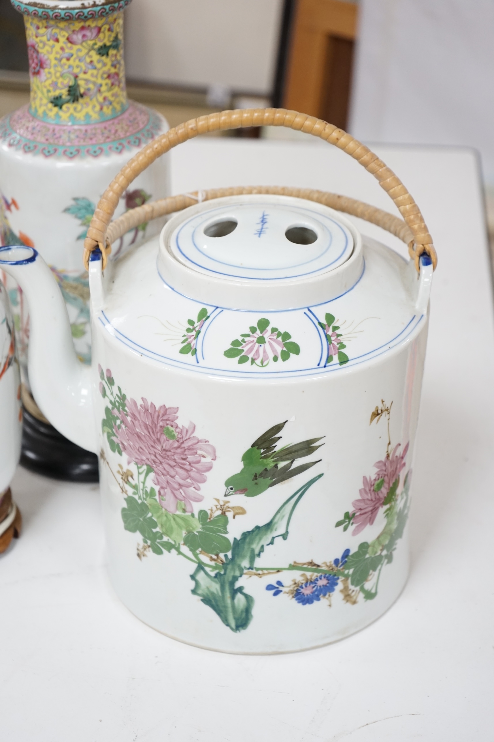 Two early 20th century Chinese famille rose lamps and a large teapot. Condition - fair